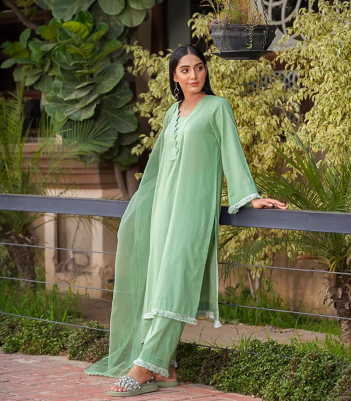 girl wearing pastel green mid season linen dress