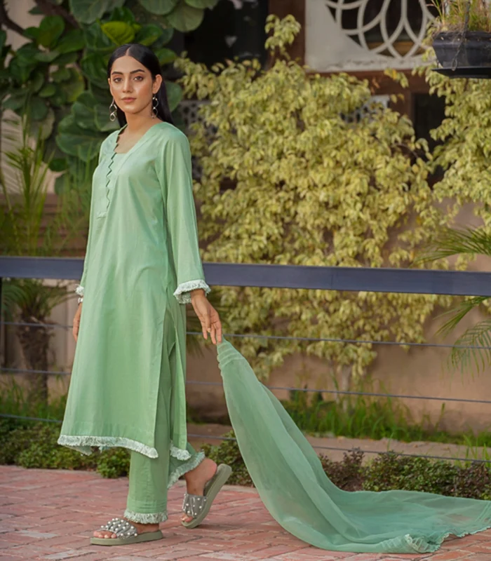 girl wearing pastel green mid season linen dress