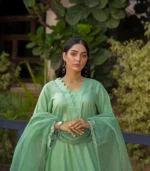 girl wearing pastel green mid season linen dress