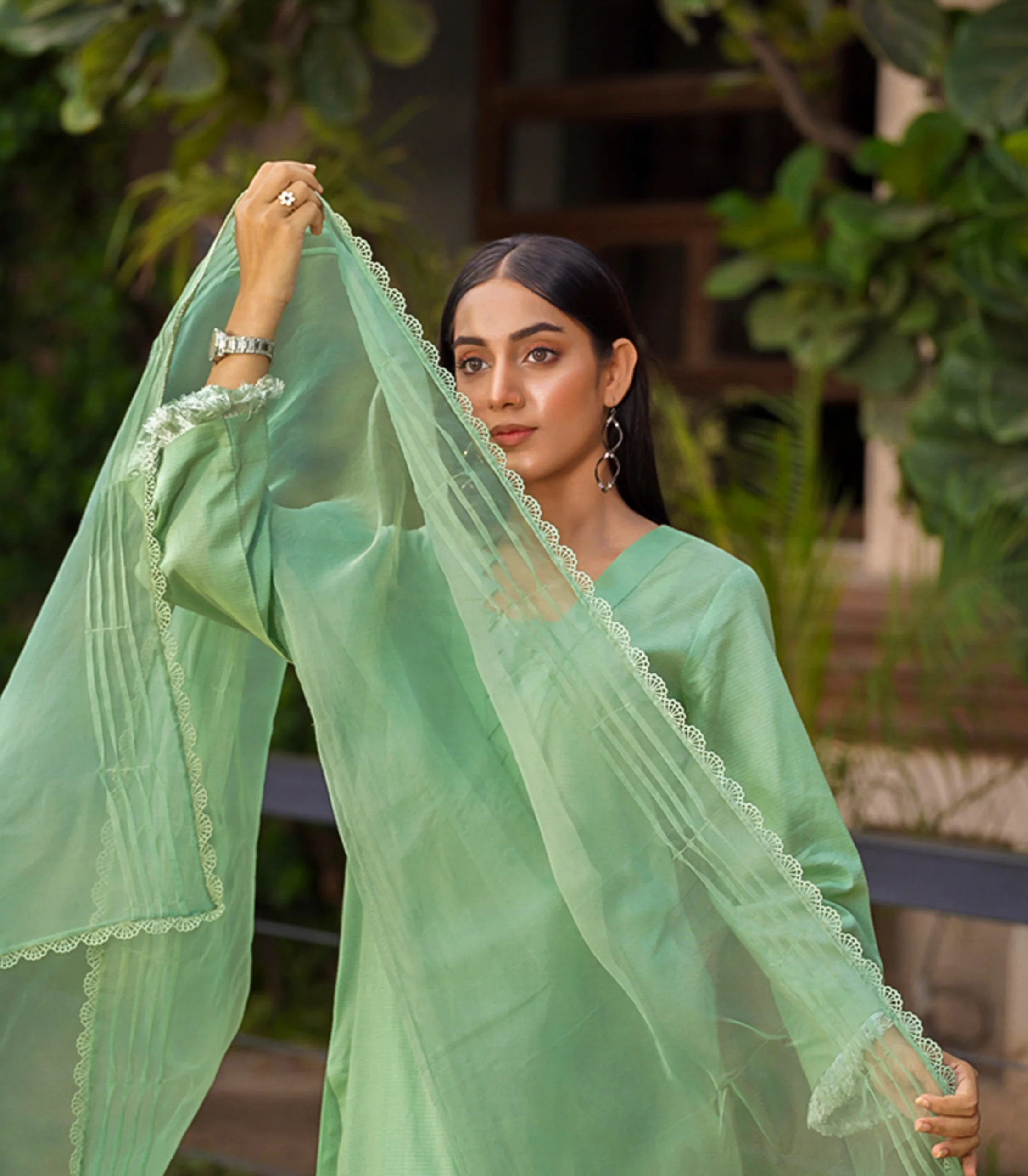 girl wearing pastel green mid season linen dress