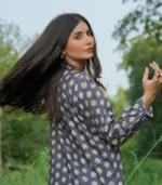 girl wearing a black printed casual shirt with smiling face and beautiful hairs